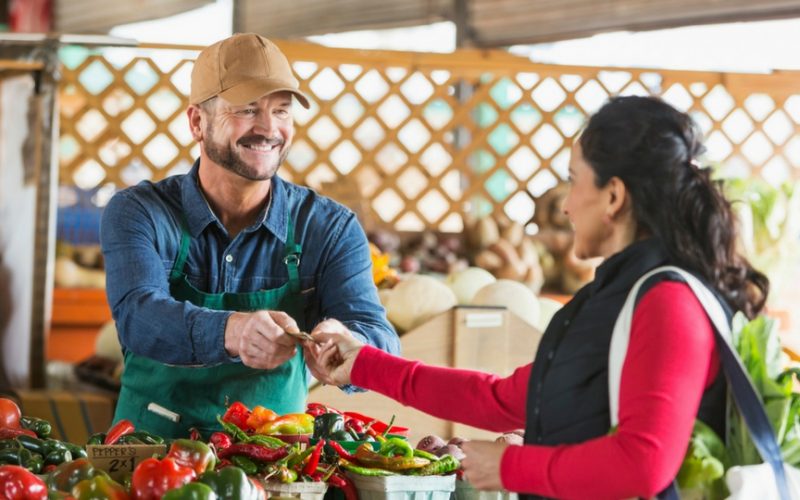 Woman buying fruit at farmers market